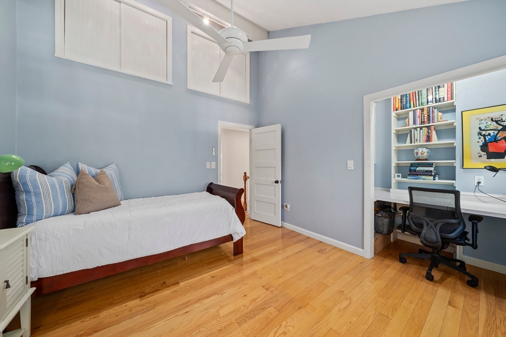 1563 Bay Road Sharon, MA 02067 - Photo 24 of 41 a bedroom with a bed and a chair in it