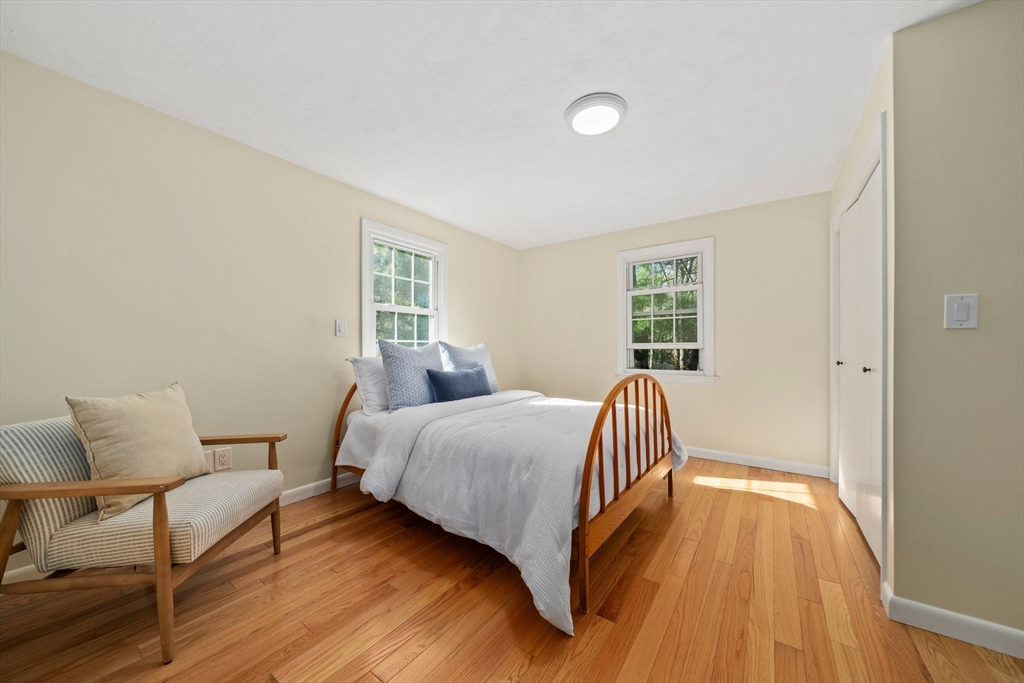 1563 Bay Road Sharon, MA 02067 - Photo 28 of 41 a bedroom with a bed and wooden floor