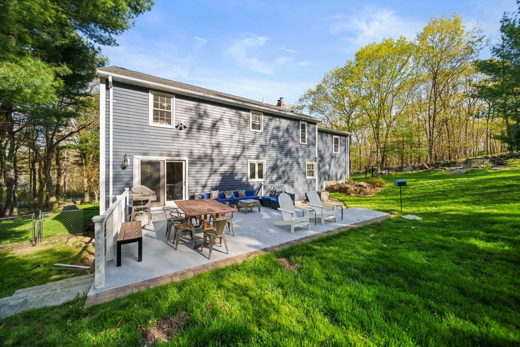 1563 Bay Road Sharon, MA 02067 - Photo 30 of 41 a view of a chair and table in backyard of the house