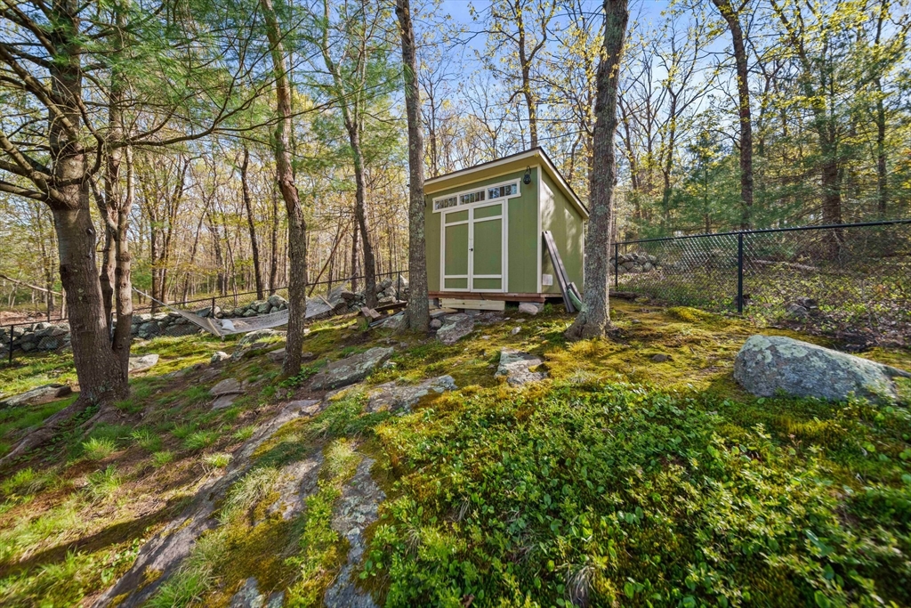 1563 Bay Road Sharon, MA 02067 - Photo 32 of 41 a backyard of a house with yard table and chairs