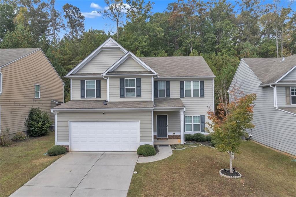 171 Pinnacle Point Court Dallas, GA 30132 - Photo 1 of 26 a front view of a house with garden
