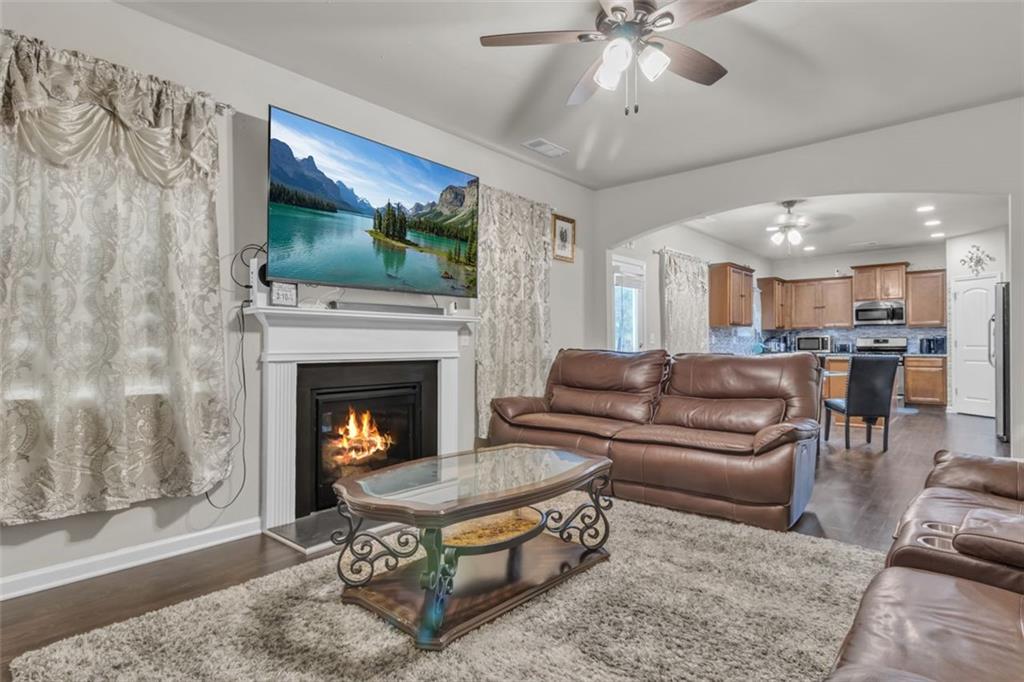 171 Pinnacle Point Court Dallas, GA 30132 - Photo 12 of 26 a living room with furniture and a fireplace