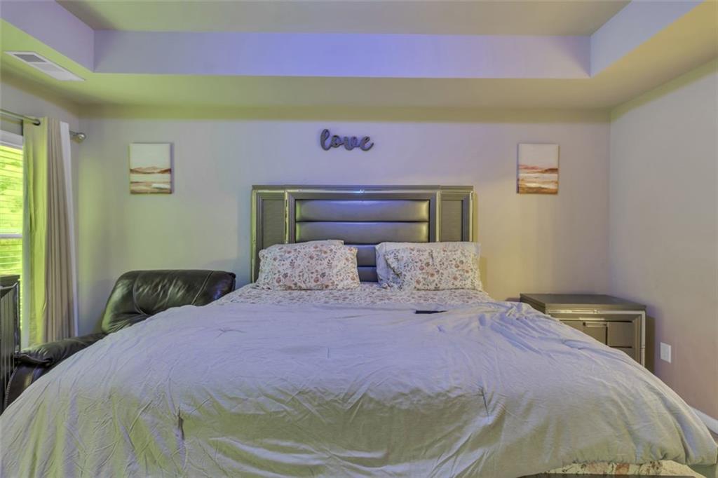 171 Pinnacle Point Court Dallas, GA 30132 - Photo 15 of 26 a bedroom with a bed and a window