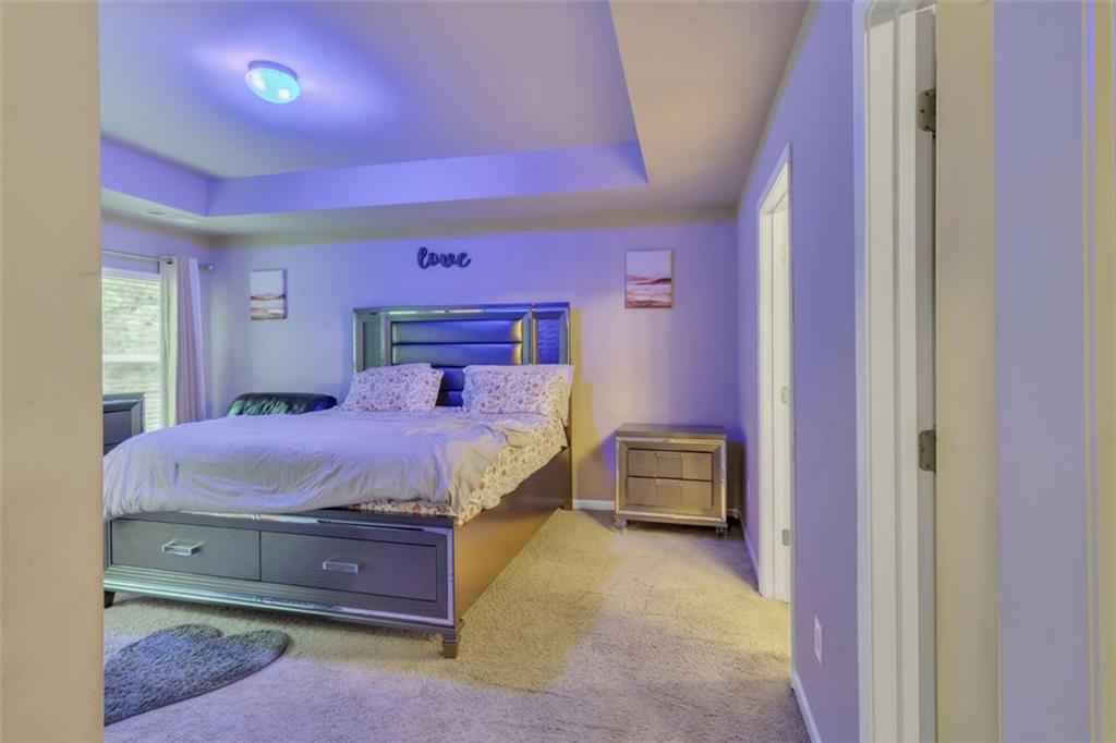 171 Pinnacle Point Court Dallas, GA 30132 - Photo 16 of 26 a bedroom with a bed and a dresser