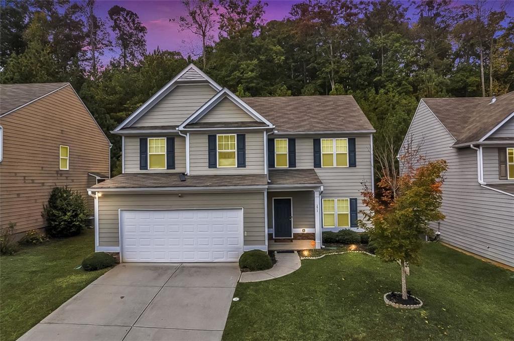 171 Pinnacle Point Court Dallas, GA 30132 - Photo 2 of 26 a front view of a house with garden