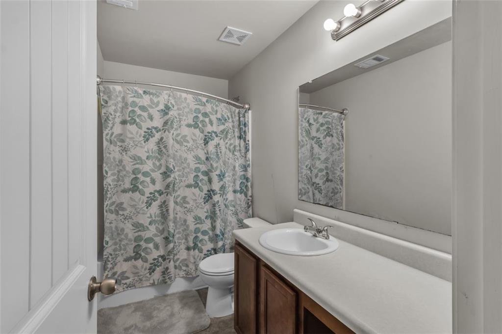 171 Pinnacle Point Court Dallas, GA 30132 - Photo 21 of 26 a bathroom with a sink toilet and shower