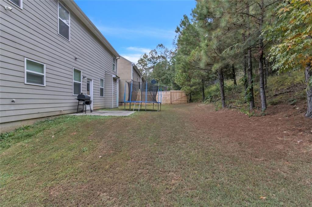 171 Pinnacle Point Court Dallas, GA 30132 - Photo 22 of 26 a view of a house with a yard