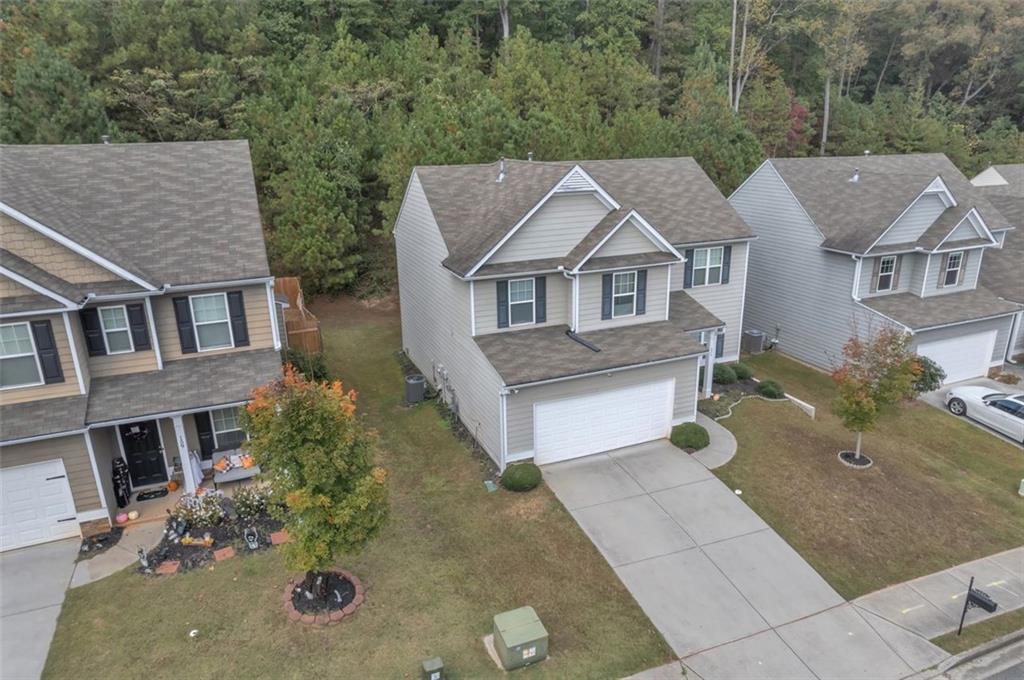 171 Pinnacle Point Court Dallas, GA 30132 - Photo 3 of 26 an aerial view of a house with yard