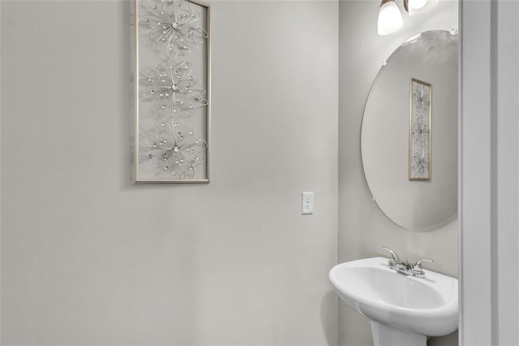171 Pinnacle Point Court Dallas, GA 30132 - Photo 10 of 26 a bathroom with a sink and a mirror