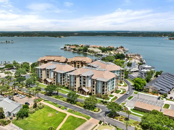 an aerial view of a house with a lake view
