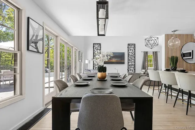 a dining room with furniture and window