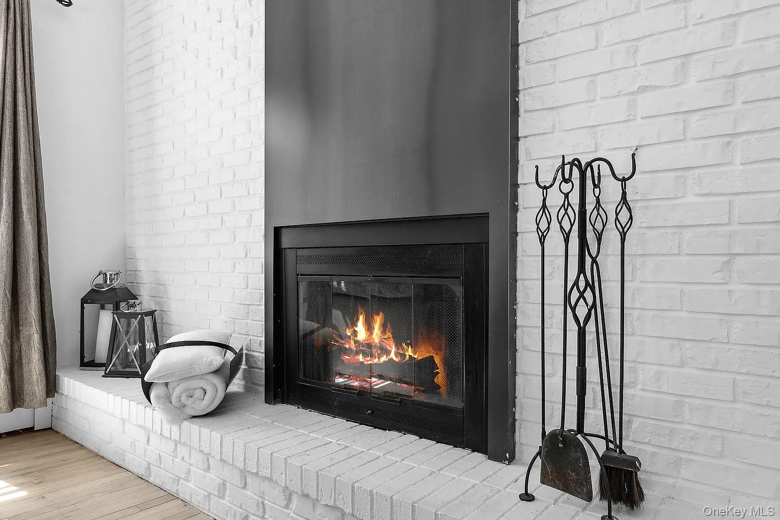 12 North Quarter Road Westhampton, NY 11977 - Photo 15 of 23 a living room with furniture and a fireplace