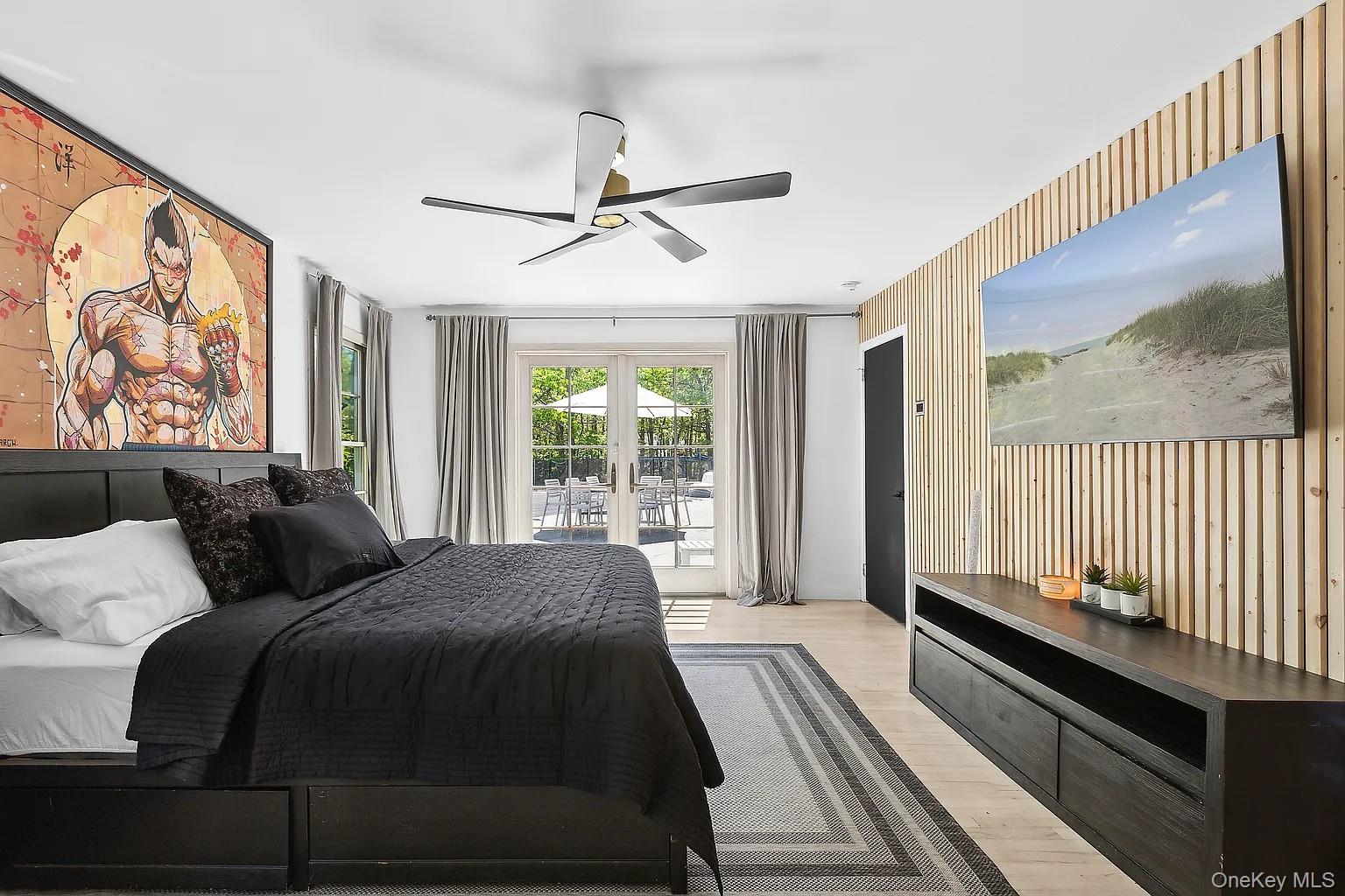 12 North Quarter Road Westhampton, NY 11977 - Photo 16 of 23 a bedroom with a bed and a large window with outer view