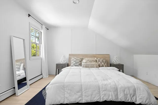 a bathroom with a sink a mirror and a toilet