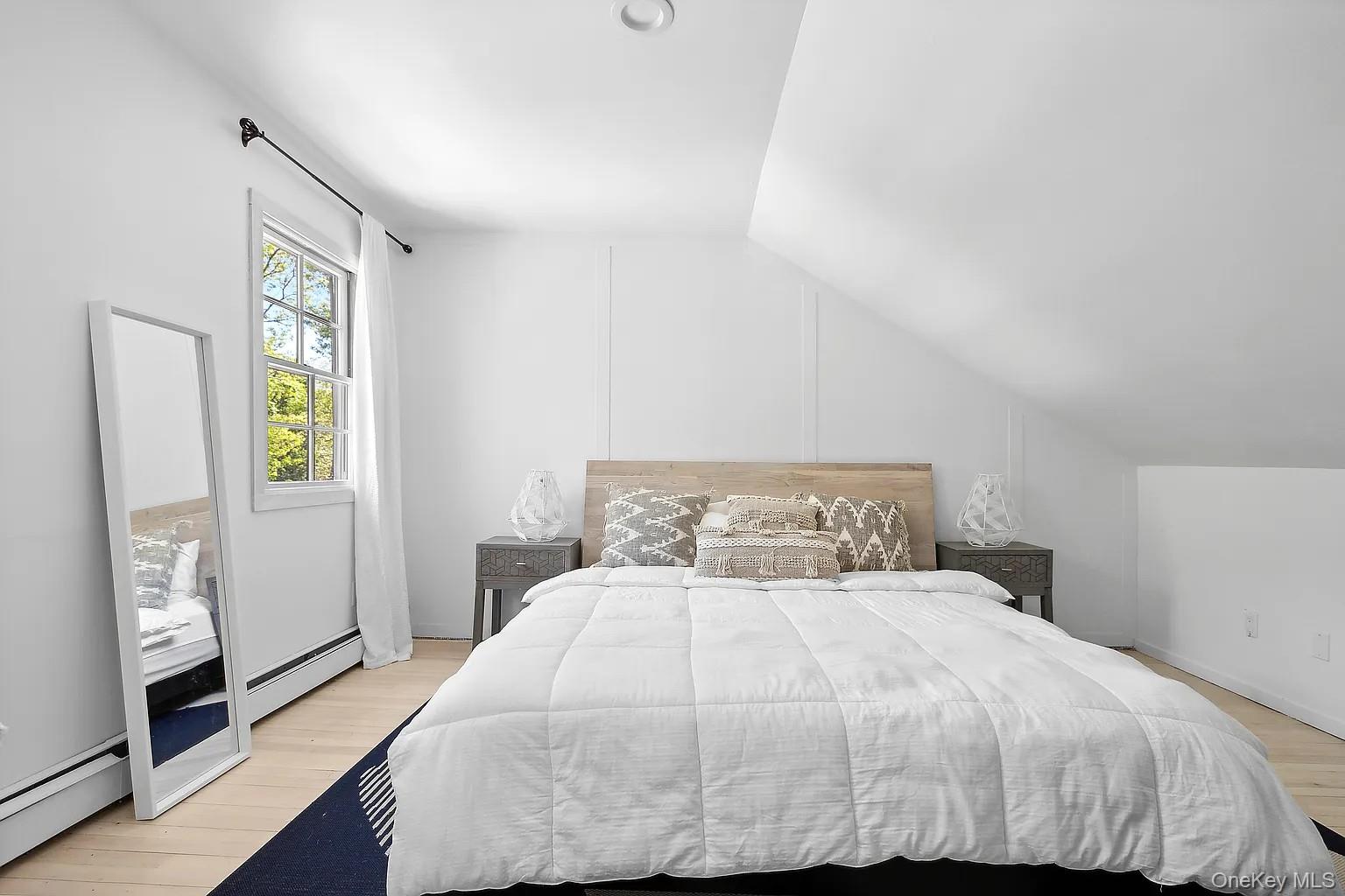 12 North Quarter Road Westhampton, NY 11977 - Photo 22 of 23 a bedroom with a bed and a window