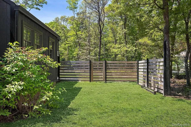 a green field covered with trees in the background