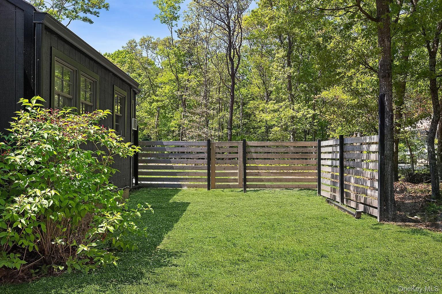 12 North Quarter Road Westhampton, NY 11977 - Photo 5 of 23 a green field covered with trees in the background