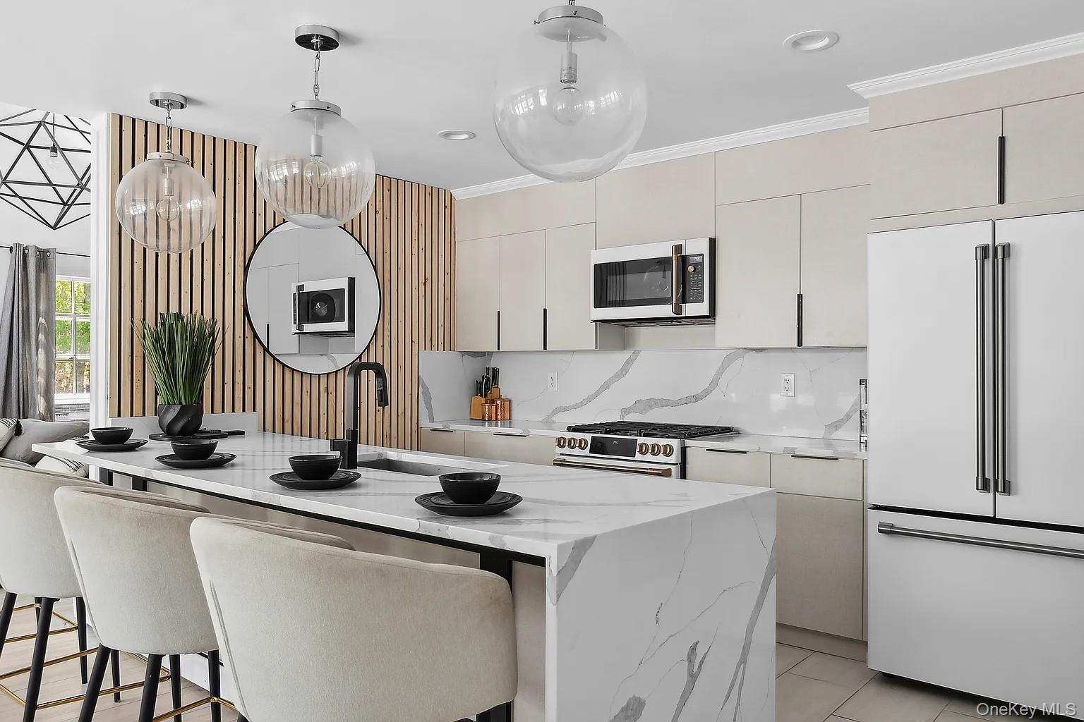 12 North Quarter Road Westhampton, NY 11977 - Photo 8 of 23 a kitchen with stainless steel appliances a sink stove and a refrigerator