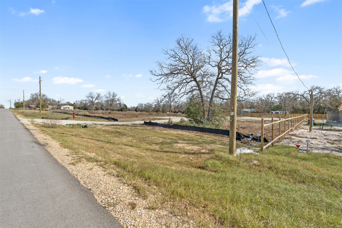 328 La Selva Drive Elgin, TX 78621 - Photo 6 of 10 View of asphalt road featuring a rural view