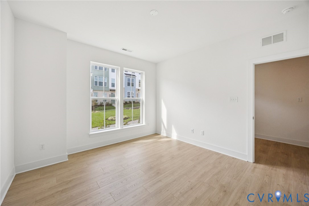 12006 Afternoon Path Henrico, VA 23233 - Photo 5 of 22 an empty room with wooden floor and windows