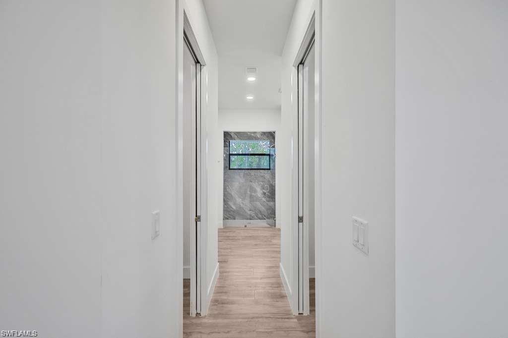 812 Homestead Road South Lehigh Acres, FL 33974 - Photo 12 of 21 a view of a hallway