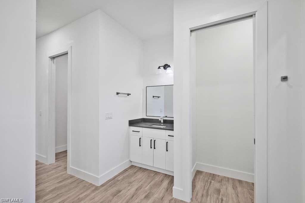 812 Homestead Road South Lehigh Acres, FL 33974 - Photo 13 of 21 a view of a kitchen from the hallway