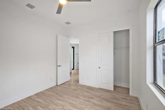 a kitchen with stainless steel appliances granite countertop a sink a refrigerator and a stove