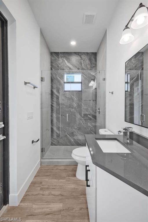 812 Homestead Road South Lehigh Acres, FL 33974 - Photo 9 of 21 a bathroom with a sink a toilet and shower