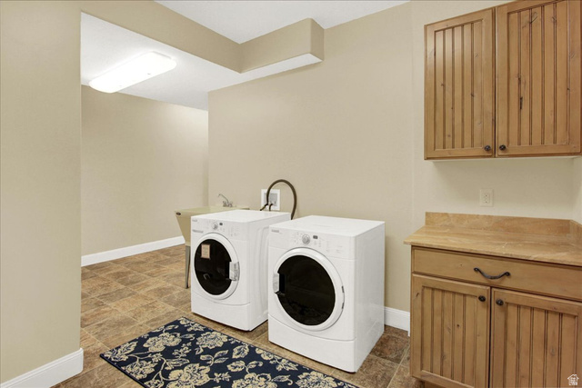667 Hardscrabble Road Morgan, UT 84050 - Photo 37 of 51 Laundry room with washer and dryer and cabinet space
