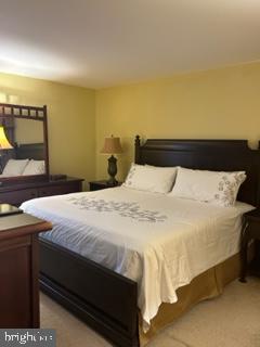 25 Country Club Road Willingboro, NJ 08046 - Photo 8 of 13 a bedroom with a bed and a night stand