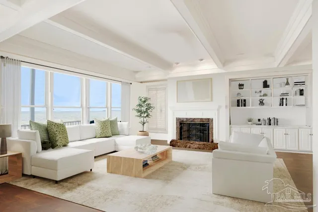 a living room with furniture and a fireplace