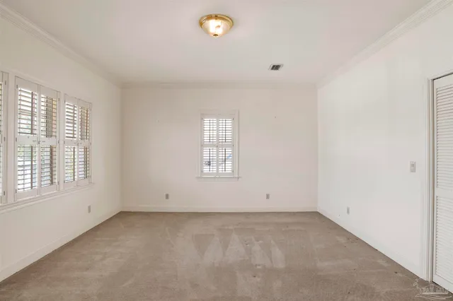 a bathroom with double vanity sinks and a mirror