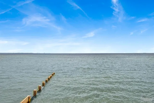 an aerial view of a house with a big yard