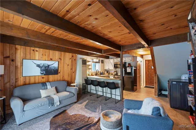 a outdoor living space with furniture and a rug