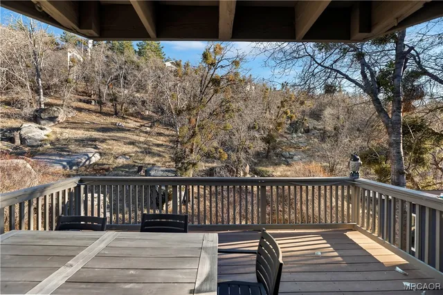 a view of balcony with wooden floor
