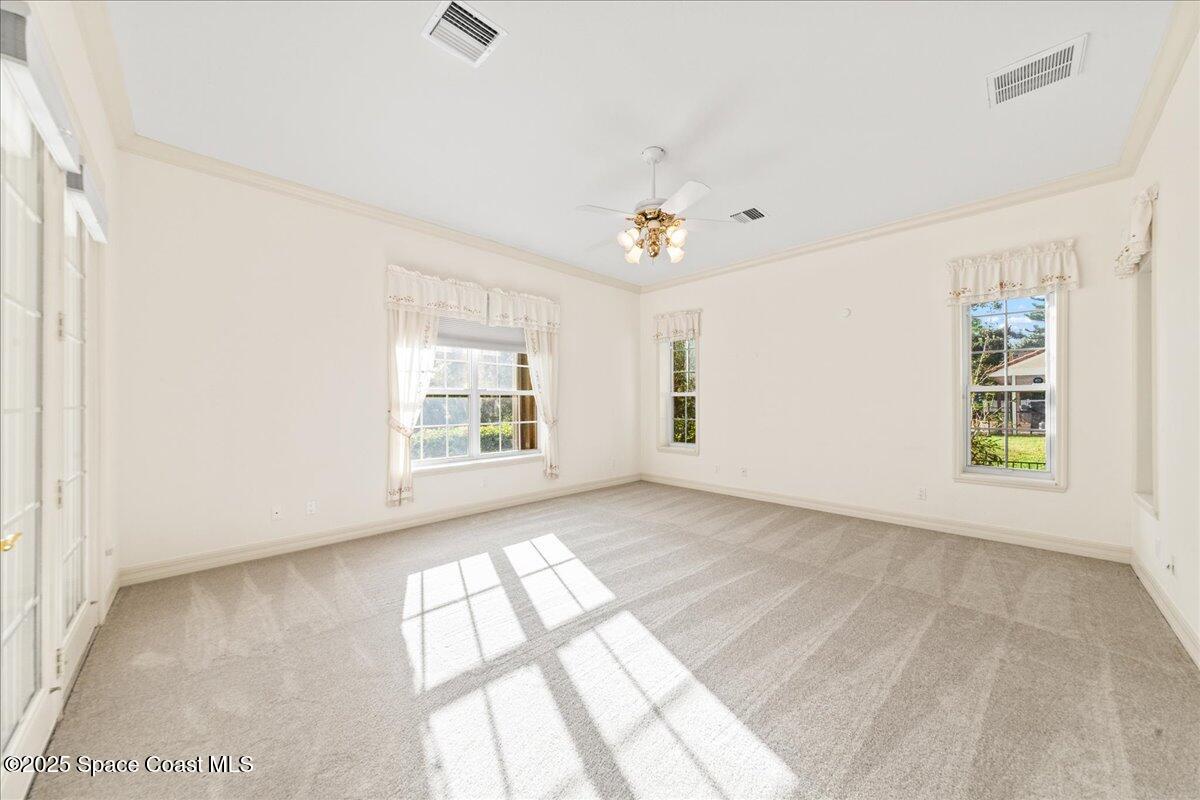 4245 Windover Way Melbourne, FL 32934 - Photo 14 of 50 a view of an empty room with a window