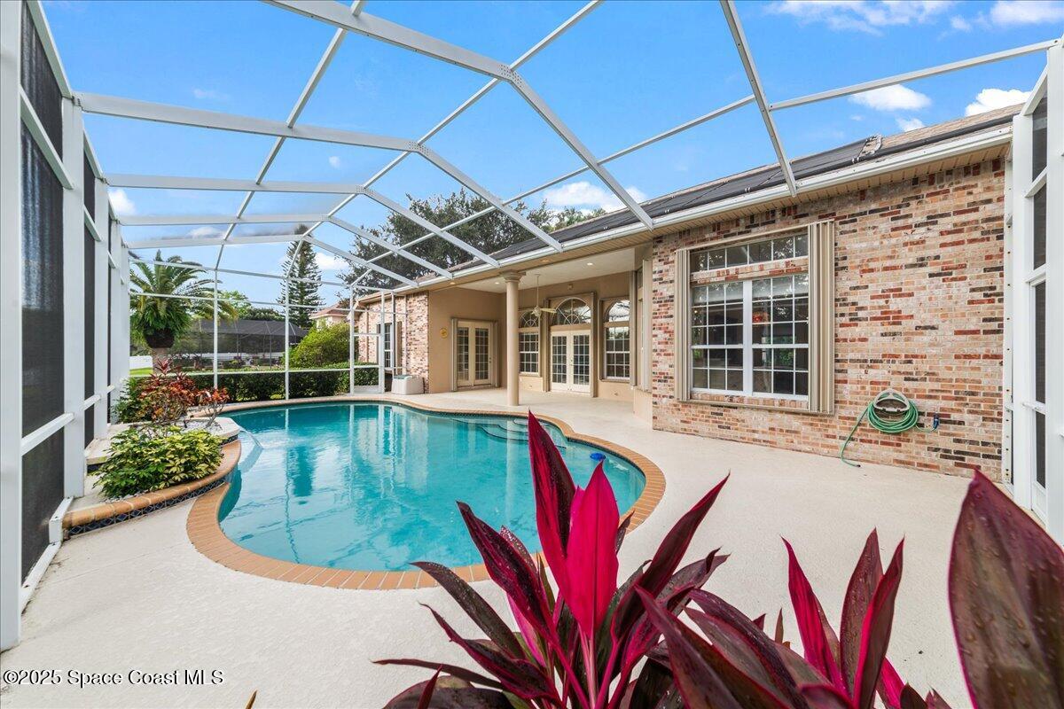 4245 Windover Way Melbourne, FL 32934 - Photo 2 of 50 a view of a swimming pool with seating space
