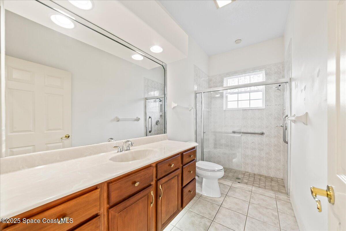 4245 Windover Way Melbourne, FL 32934 - Photo 21 of 50 a bathroom with a sink a toilet and shower