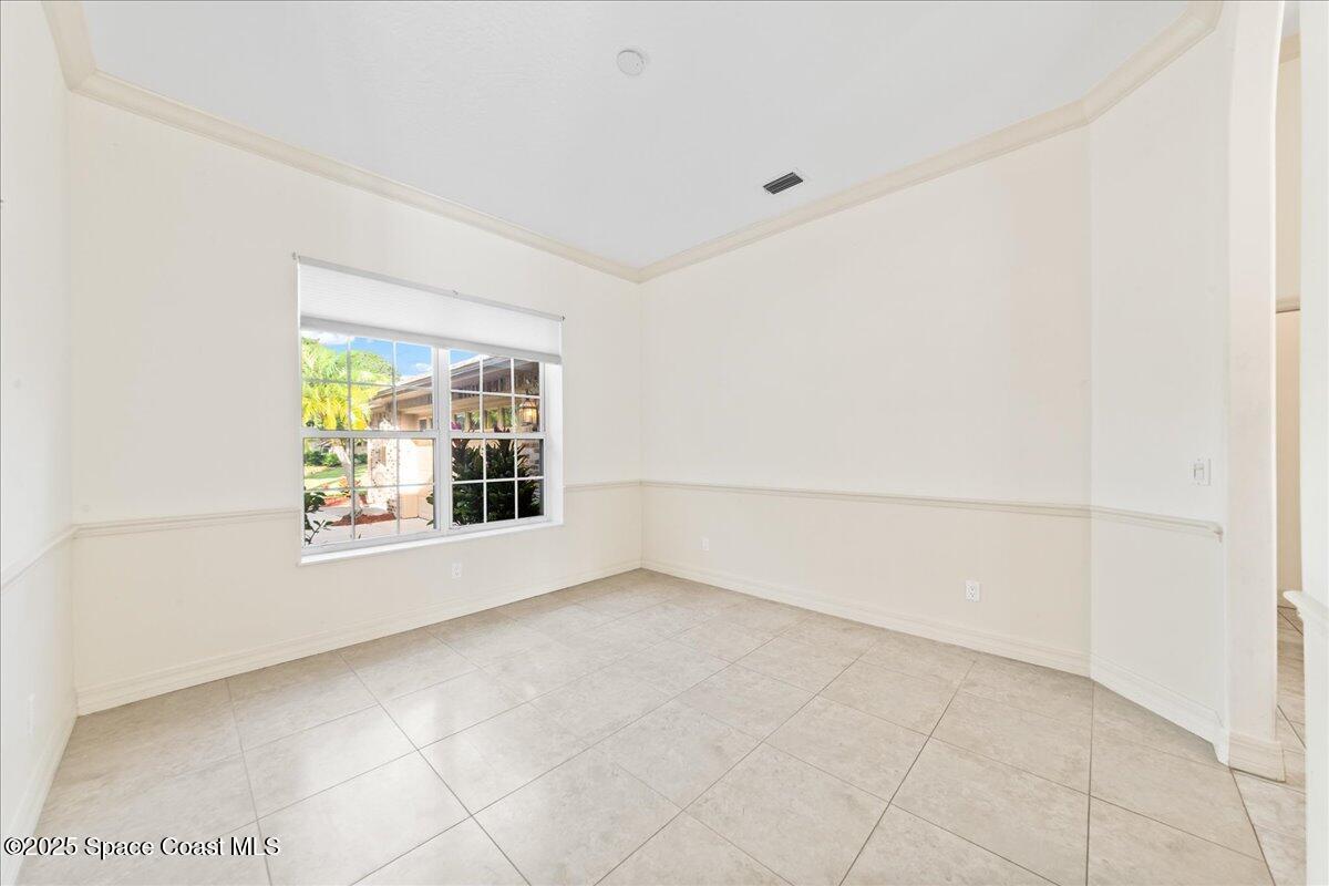 4245 Windover Way Melbourne, FL 32934 - Photo 24 of 50 an empty room with windows