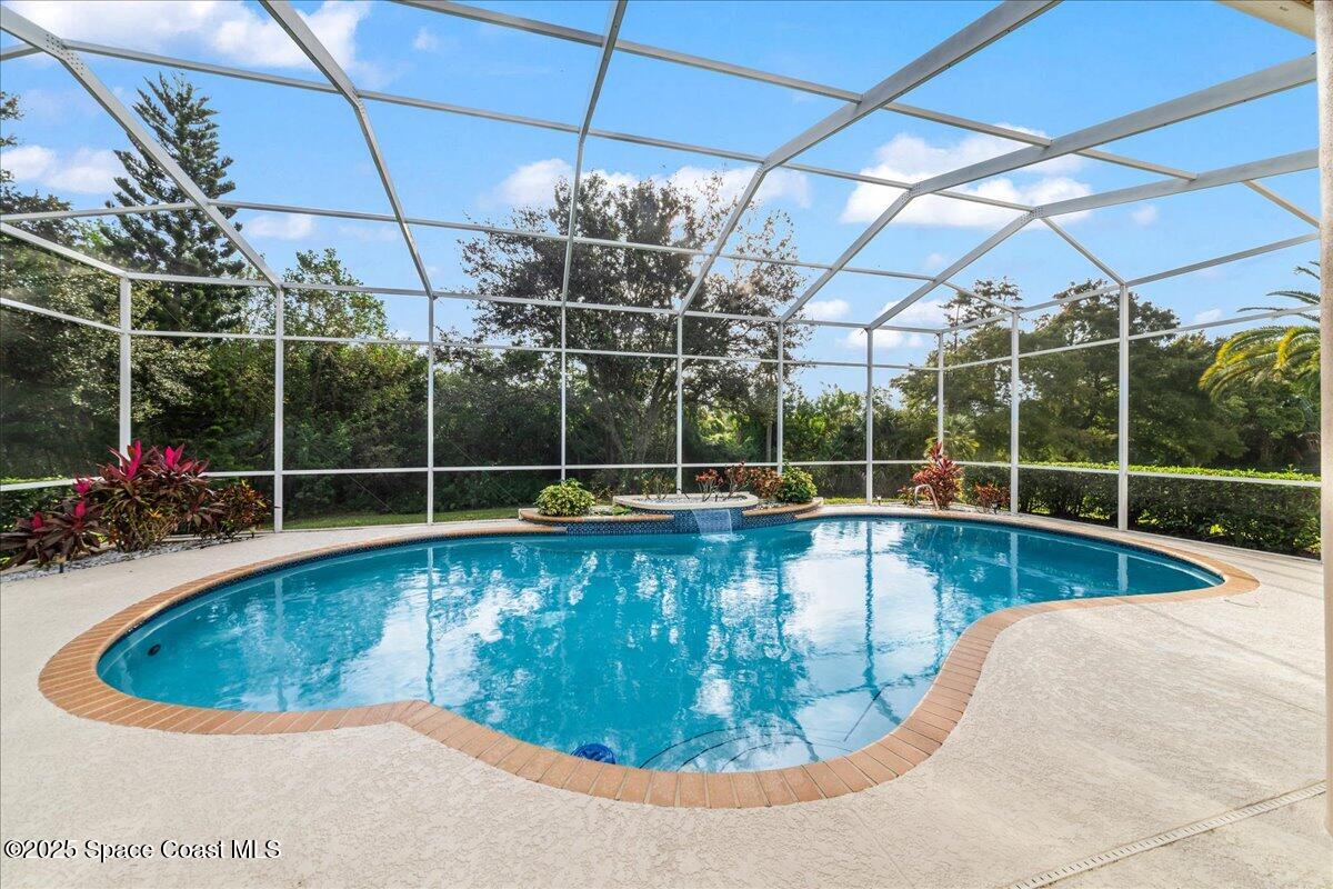 4245 Windover Way Melbourne, FL 32934 - Photo 28 of 50 a view of a swimming pool with a yard in back