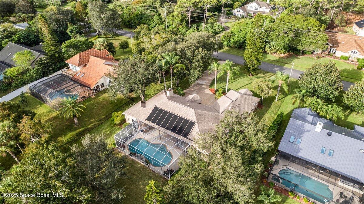 4245 Windover Way Melbourne, FL 32934 - Photo 30 of 50 an aerial view of a house with a yard and lake view