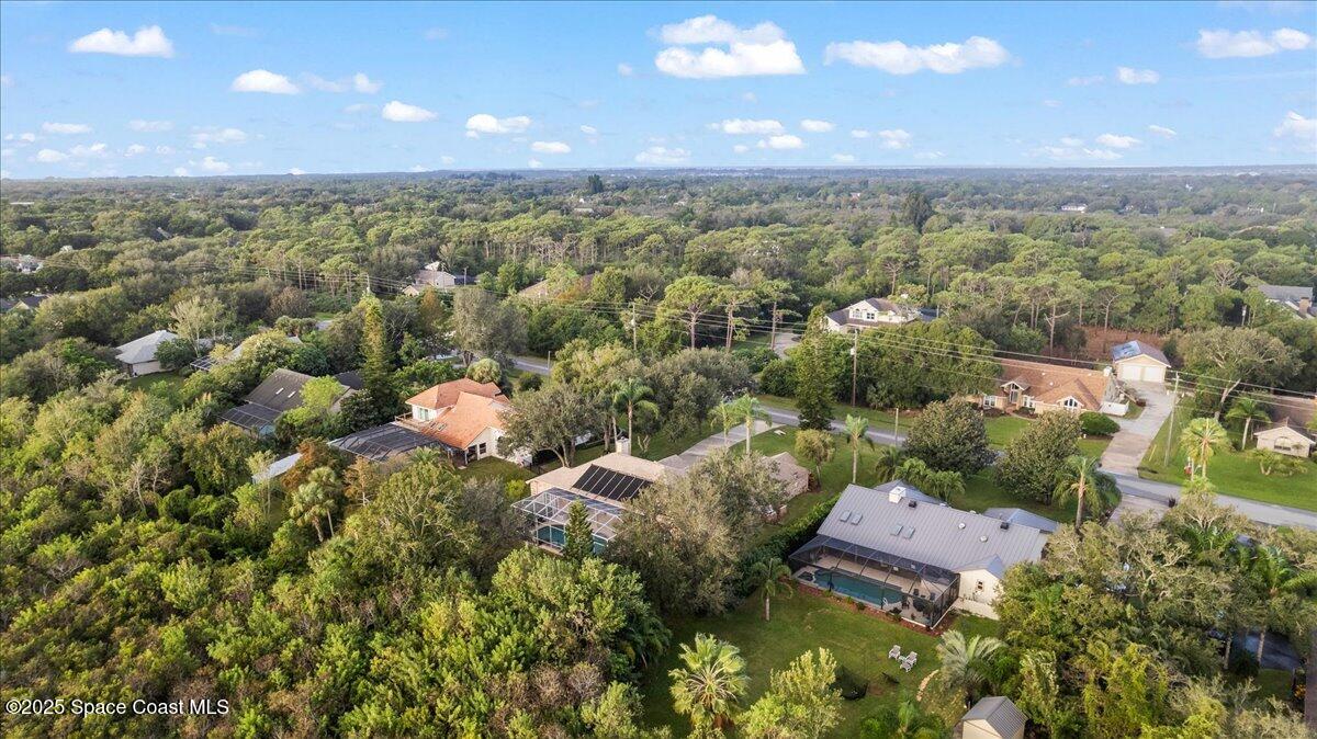 4245 Windover Way Melbourne, FL 32934 - Photo 31 of 50 an aerial view of a residential houses with outdoor space and trees