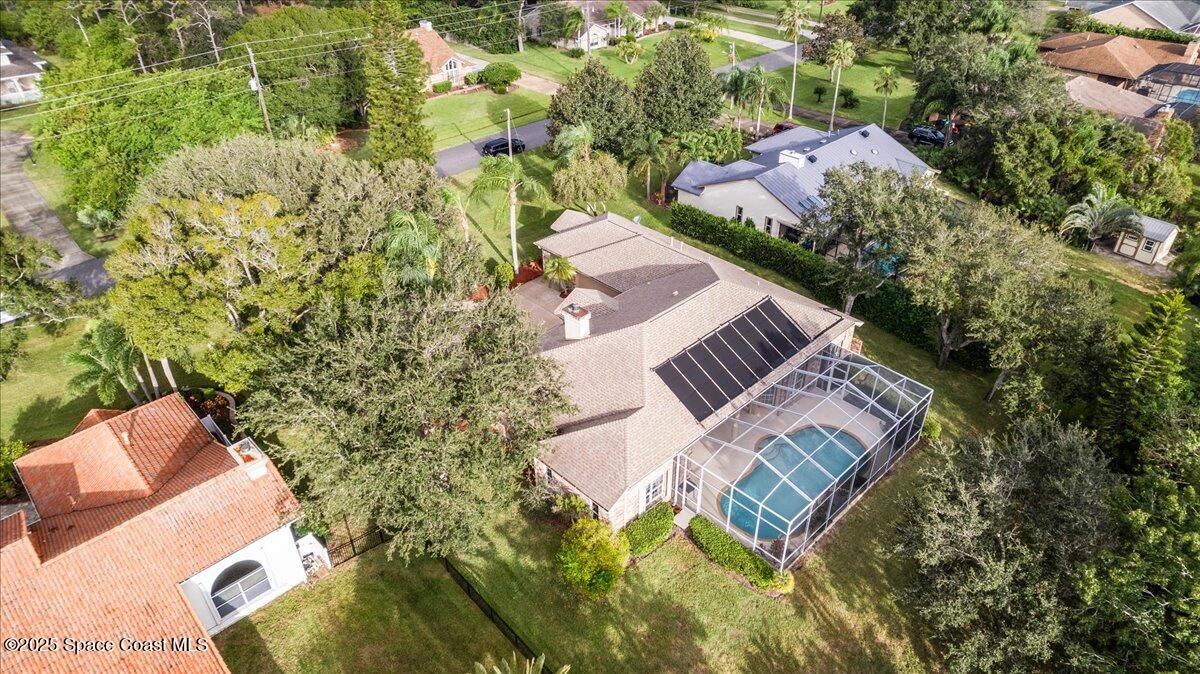4245 Windover Way Melbourne, FL 32934 - Photo 32 of 50 an aerial view of a house with swimming pool and ocean view