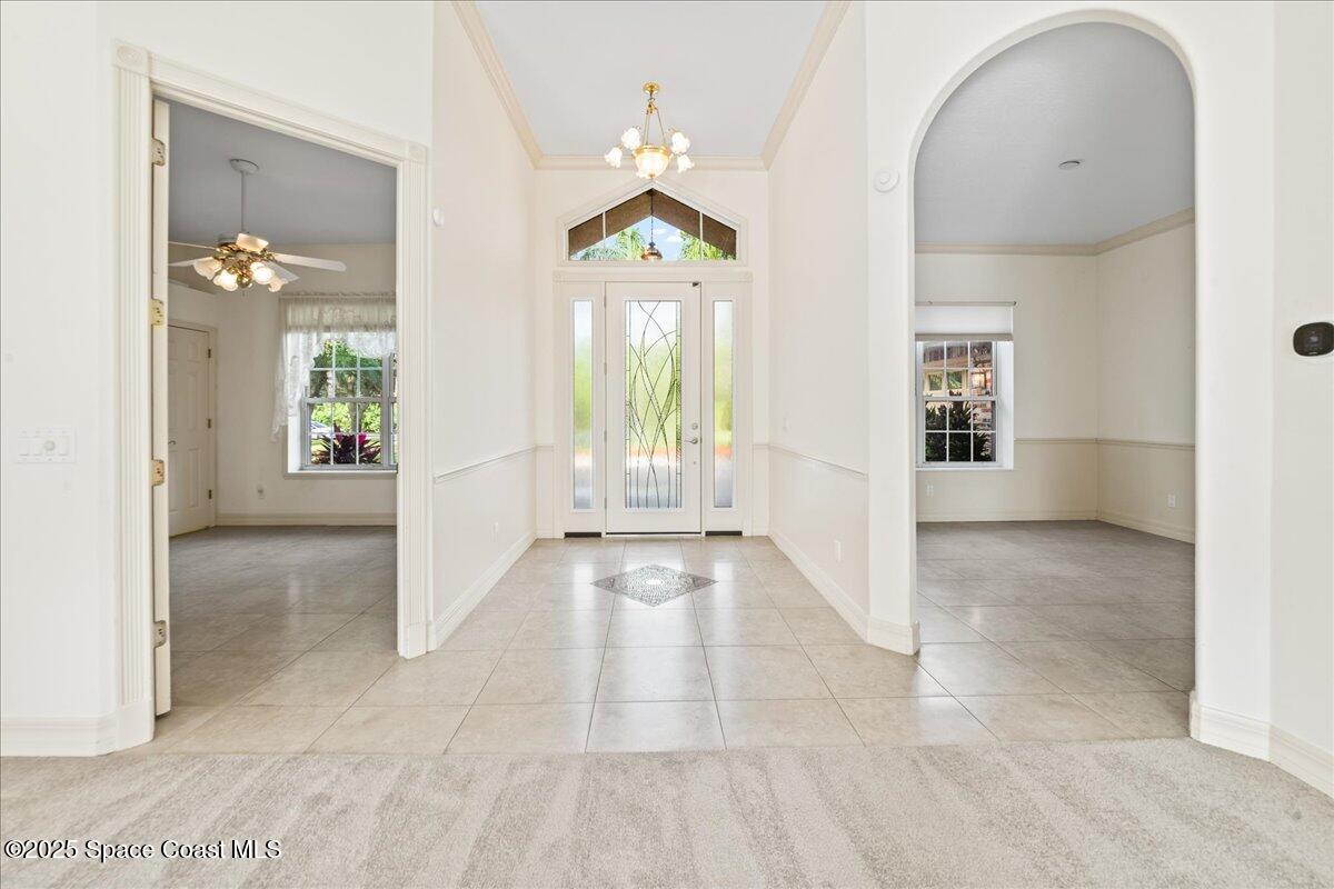 4245 Windover Way Melbourne, FL 32934 - Photo 4 of 50 a view of an entryway with wooden floor