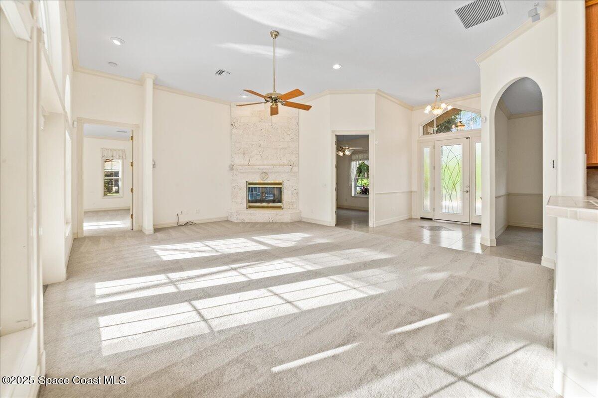 4245 Windover Way Melbourne, FL 32934 - Photo 5 of 50 a view of a hallway with entryway wooden floor and windows