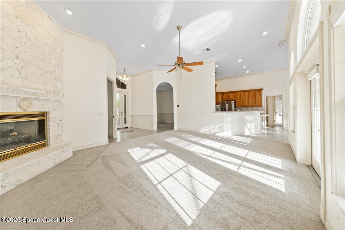 4245 Windover Way Melbourne, FL 32934 - Photo 6 of 50 a view of an empty room and a fireplace