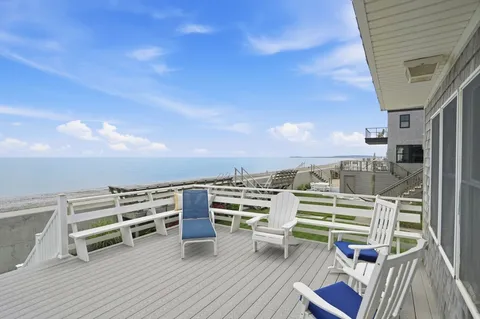 a view of roof deck with patio