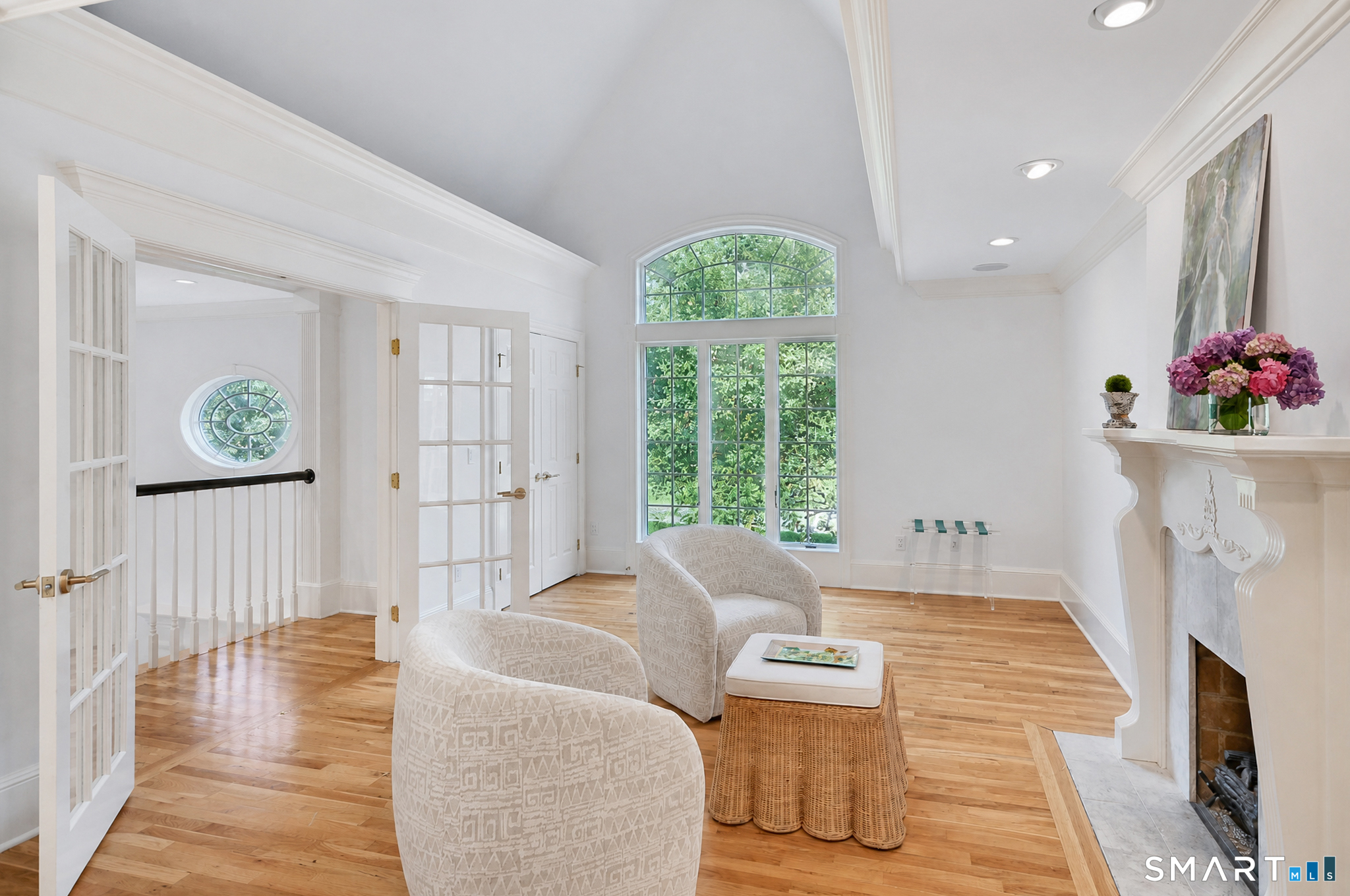17 Kent Road Newtown, CT 06470 - Photo 17 of 40 Cozy sitting area with a fireplace, hardwood floors and large windows.