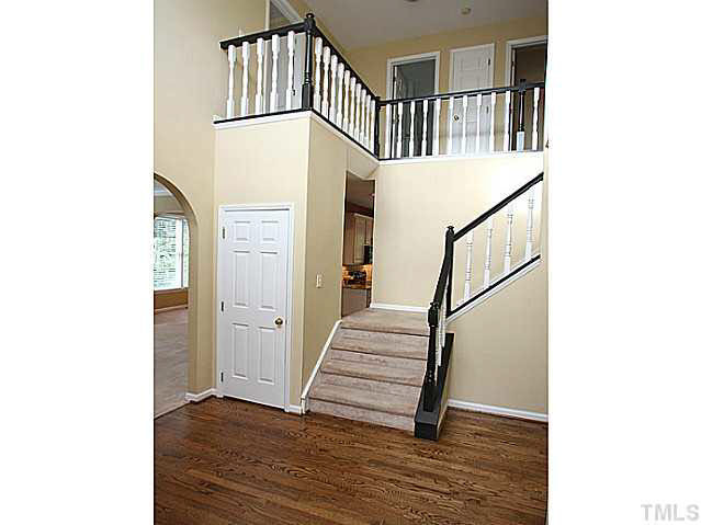 8405 Evans Mill Place Raleigh, NC 27613 - Photo 2 of 25 Enter into the grand foyer with a split staircase (from the foyer and the kitchen). Foyer