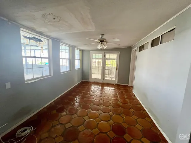 a view of an empty room and window